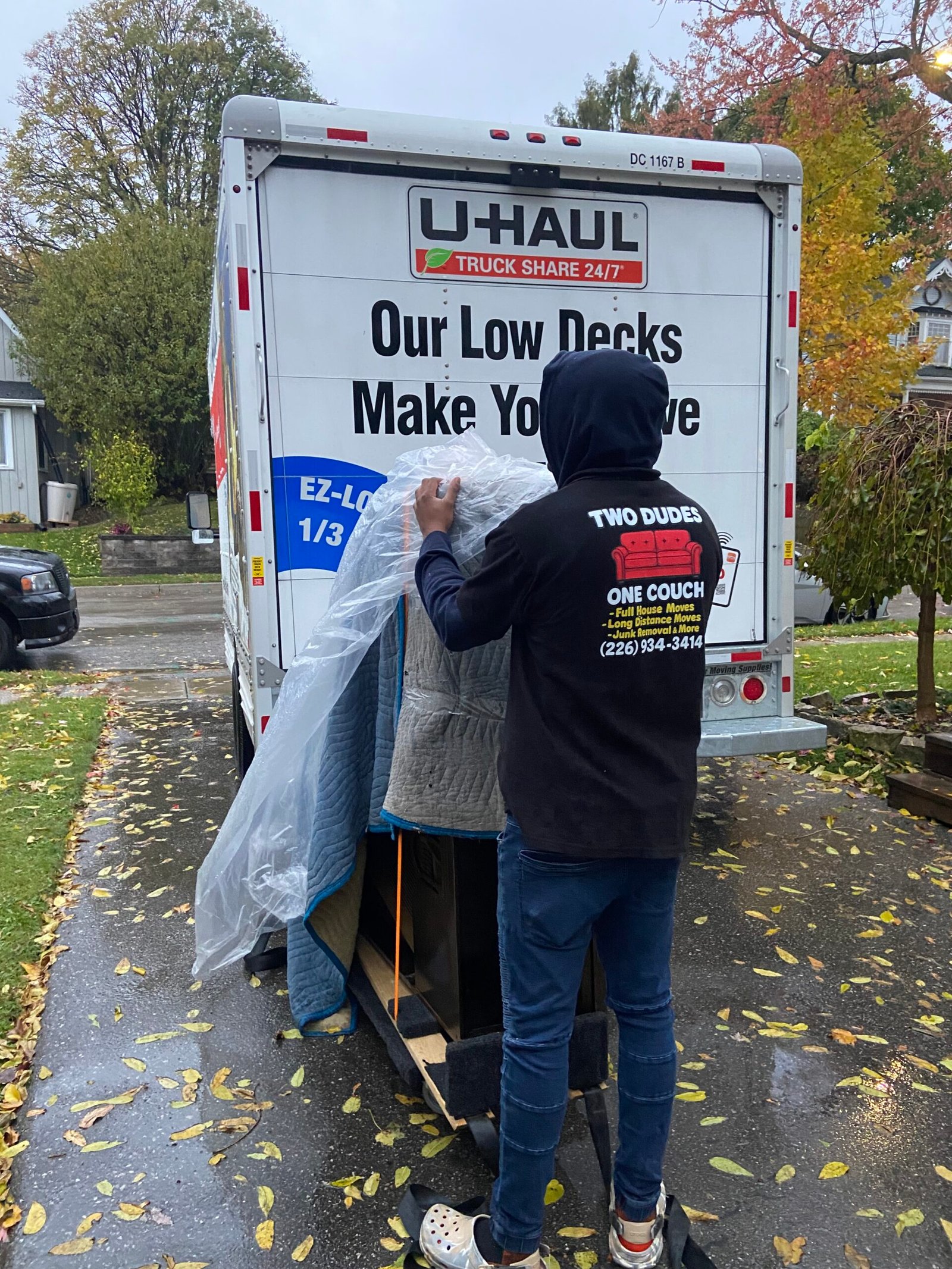 Baby grand piano being moved with legs removed.